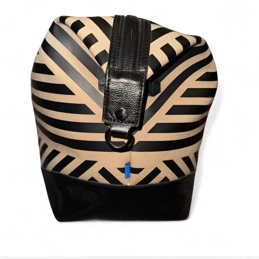 Uri Minkoff tan and black leather geometric design travel bag